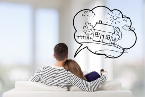 Young,Couple,Sitting,On,Sofa